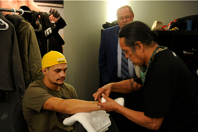 LACHUTE, CANADA - NOVEMBER 11: Team Australia fighter Tyler Manawaroa gets his hands taped prior to facing Team Canada fighter Nordine Taleb in their middleweight fight during filming of The Ultimate Fighter Nations television series on November 11, 2013