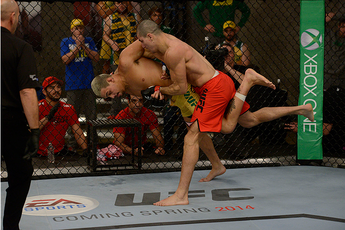 LACHUTE, CANADA - NOVEMBER 11: Team Canada fighter Nordine Taleb takes down Team Australia fighter Tyler Manawaroa in their middleweight fight during filming of The Ultimate Fighter Nations television series on November 11, 2013 in Lachute, Quebec, Canad