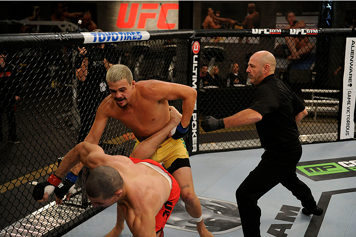 LACHUTE, CANADA - NOVEMBER 11: Team Australia fighter Tyler Manawaroa (top) attempts a takedown against Team Canada fighter Nordine Taleb in their middleweight fight during filming of The Ultimate Fighter Nations television series on November 11, 2013 in
