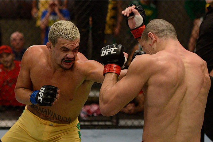 LACHUTE, CANADA - NOVEMBER 11: (L-R) Team Australia fighter Tyler Manawaroa punches Team Canada fighter Nordine Taleb in their middleweight fight during filming of The Ultimate Fighter Nations television series on November 11, 2013 in Lachute, Quebec, Ca
