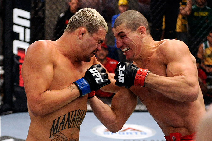 LACHUTE, CANADA - NOVEMBER 11: (L-R) Team Australia fighter Tyler Manawaroa punches Team Canada fighter Nordine Taleb in their middleweight fight during filming of The Ultimate Fighter Nations television series on November 11, 2013 in Lachute, Quebec, Ca
