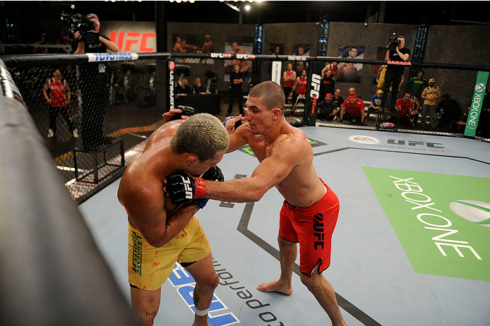LACHUTE, CANADA - NOVEMBER 11: (R-L) Team Canada fighter Nordine Taleb controls the body of Team Australia fighter Tyler Manawaroa in their middleweight fight during filming of The Ultimate Fighter Nations television series on November 11, 2013 in Lachut