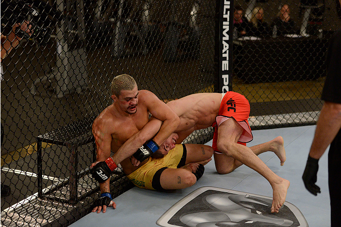 LACHUTE, CANADA - NOVEMBER 11: (L-R) Team Canada fighter Nordine Taleb takes down Team Australia fighter Tyler Manawaroa in their middleweight fight during filming of The Ultimate Fighter Nations television series on November 11, 2013 in Lachute, Quebec,