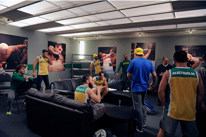 LACHUTE, CANADA - NOVEMBER 11: Team Australia fighter Tyler Manawaroa celebrates with his team after defeating Team Canada fighter Nordine Taleb in their middleweight fight during filming of The Ultimate Fighter Nations television series on November 11,