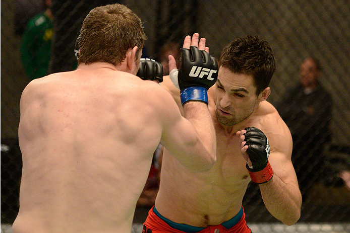 LACHUTE, CANADA - NOVEMBER 17: (R-L) Team Canada fighter Sheldon Westcott punches Team Australia fighter Daniel Kelly in their middleweight fight during filming of The Ultimate Fighter Nations television series on November 17, 2013 in Lachute, Quebec, Ca
