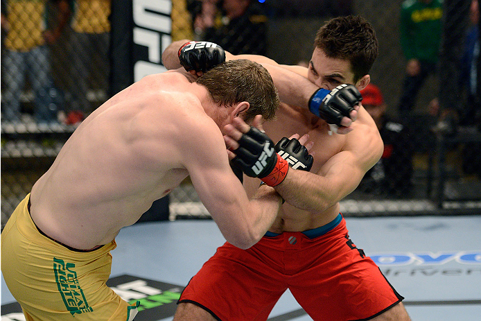 LACHUTE, CANADA - NOVEMBER 17: (L-R) Team Australia fighter Daniel Kelly lands a forearm to the face of Team Canada fighter Sheldon Westcott in their middleweight fight during filming of The Ultimate Fighter Nations television series on November 17, 2013