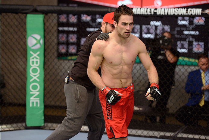LACHUTE, CANADA - NOVEMBER 17: Team Canada fighter Sheldon Westcott celebrates after submitting Team Australia fighter Daniel Kelly in their middleweight fight during filming of The Ultimate Fighter Nations television series on November 17, 2013 in Lachu