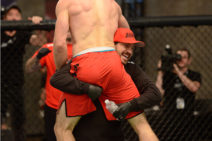 LACHUTE, CANADA - NOVEMBER 17: Team Canada coach Patrick Cote cheers on his fighter Sheldon Westcott after submitting Team Australia fighter Daniel Kelly in their middleweight fight during filming of The Ultimate Fighter Nations television series on Nove