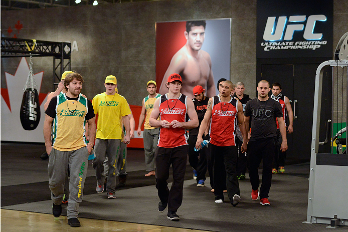 LACHUTE, CANADA - DECEMBER 2: Team Australia and Team Canada fighter walk into the gym during filming of The Ultimate Fighter Nations television series on December 2, 2013 in Lachute, Quebec, Canada. (Photo by Richard Wolowicz/Zuffa LLC/Zuffa LLC via Get
