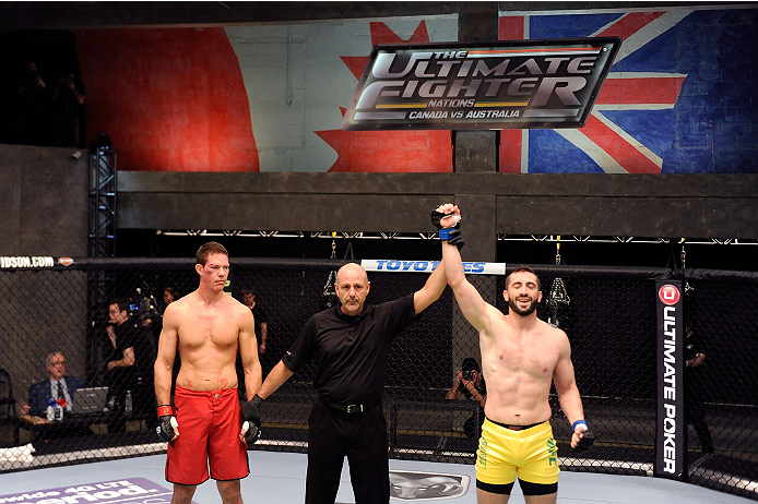 LACHUTE, CANADA - DECEMBER 2: Team Australia fighter Vik Grujic (R) is declared the winner over Team Canada fighter Luke Harris by referee Yves Lavigne after their middleweight fight during filming of The Ultimate Fighter Nations television series on Dec