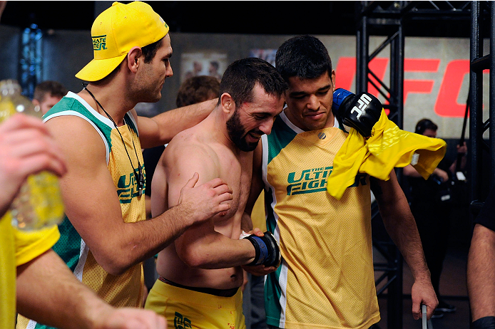 LACHUTE, CANADA - DECEMBER 2: Team Australia fighter Vik Grujic (C) is congratulated by his teammates after defeating Team Canada fighter Luke Harris in their middleweight fight during filming of The Ultimate Fighter Nations television series on December