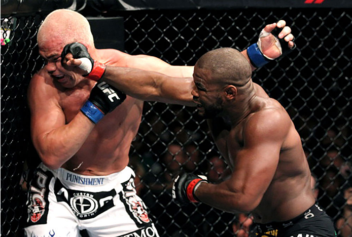 PHILADELPHIA, PA - AUGUST 06: (R-L) Rashad Evans punches Tito Ortiz during a light heavyweight bout at UFC 133 at Wells Fargo Center on August 6, 2011 in Philadelphia, Pennsylvania. (Photo by Al Bello/Zuffa LLC/Zuffa LLC via Getty Images)