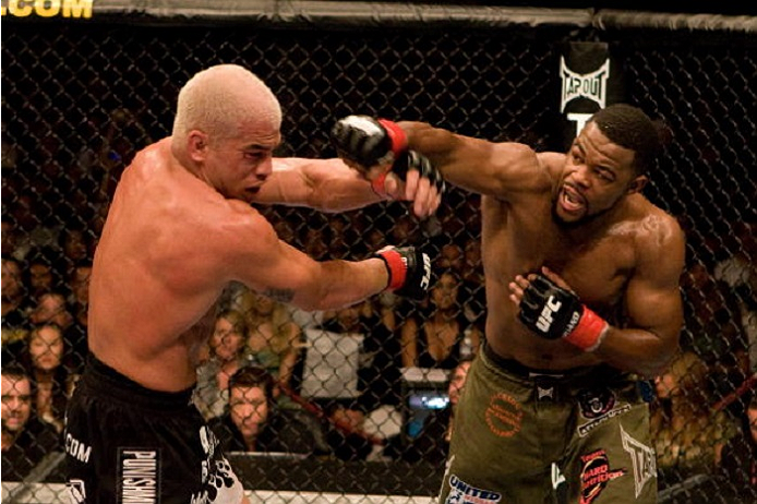 SACRAMENTO, CA - JULY 7: Rashad Evans (green shorts) vs. Tito Ortiz (black/flame shorts) - Draw during UFC 73 at Arco Arena on July 7, 2007 in Sacramento, California. (Photo by Josh Hedges/Zuffa LLC via Getty Images)