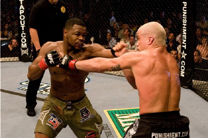 SACRAMENTO, CA - JULY 7: Rashad Evans (green shorts) vs. Tito Ortiz (black/flame shorts) - Draw during UFC 73 at Arco Arena on July 7, 2007 in Sacramento, California. (Photo by Josh Hedges/Zuffa LLC via Getty Images)
