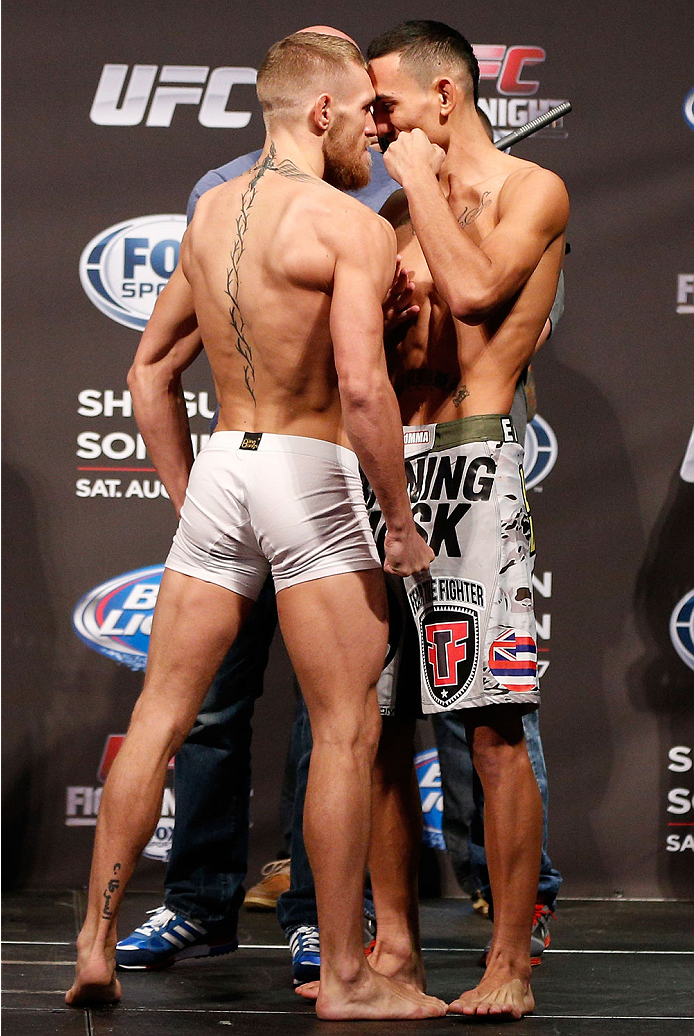 BOSTON, MA - AUGUST 16: (L-R) Opponents Conor McGregor and Max Holloway face off during the UFC weigh-in inside TD Garden on August 16, 2013 in Boston, Massachusetts. (Photo by Josh Hedges/Zuffa LLC/Zuffa LLC via Getty Images)