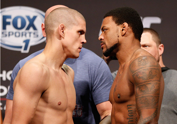 BOSTON, MA - AUGUST 16: (L-R) Opponents Joe Lauzon and Michael Johnson face off during the UFC weigh-in inside TD Garden on August 16, 2013 in Boston, Massachusetts. (Photo by Josh Hedges/Zuffa LLC/Zuffa LLC via Getty Images)