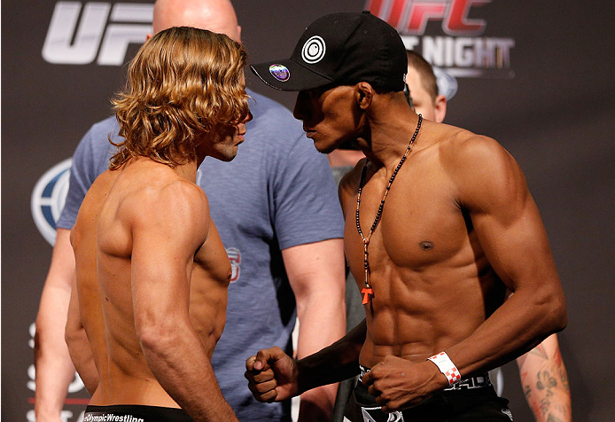 BOSTON, MA - AUGUST 16: (L-R) Opponents Urijah Faber and Iuri Alcantara face off during the UFC weigh-in inside TD Garden on August 16, 2013 in Boston, Massachusetts. (Photo by Josh Hedges/Zuffa LLC/Zuffa LLC via Getty Images)
