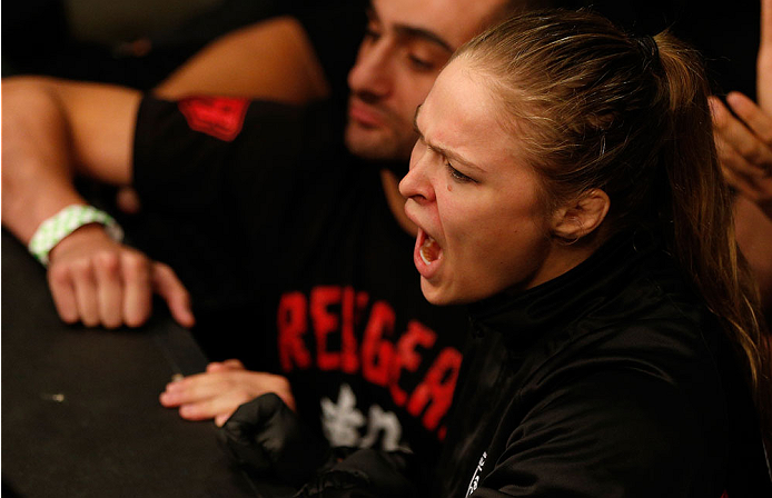 BOSTON, MA - AUGUST 17: UFC women's bantamweight champion Ronda Rousey supports teammate Manny Gamburyan during his UFC featherweight bout against Cole Miller at TD Garden on August 17, 2013 in Boston, Massachusetts. (Photo by Josh Hedges/Zuffa LLC/Zuffa