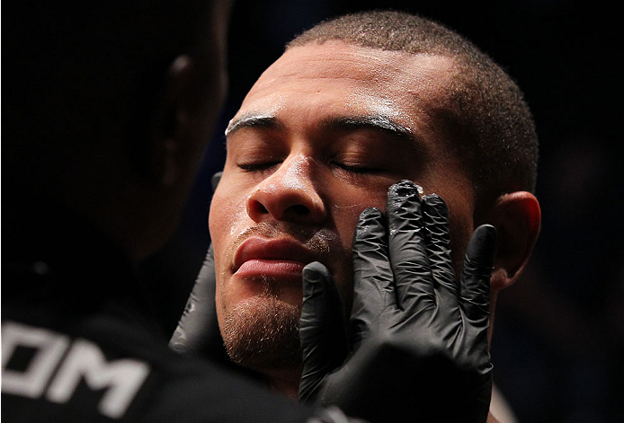INDIANAPOLIS, IN - AUGUST 28: Abel Trujillo prepares to enter the Octagon before his lightweight fight against Roger Bowling during the UFC on FOX Sports 1 event at Bankers Life Fieldhouse on August 28, 2013 in Indianapolis, Indiana. (Photo by Ed Mulholl