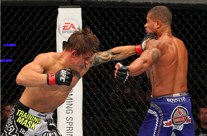 INDIANAPOLIS, IN - AUGUST 28: (L-R) Roger Bowling punches Abel Trujillo in their lightweight fight during the UFC on FOX Sports 1 event at Bankers Life Fieldhouse on August 28, 2013 in Indianapolis, Indiana. (Photo by Ed Mulholland/Zuffa LLC/Zuffa LLC vi