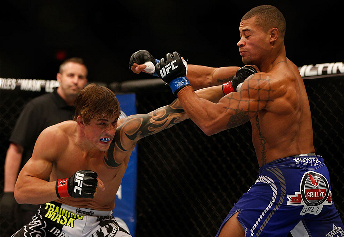 INDIANAPOLIS, IN - AUGUST 28: (L-R) Roger Bowling punches Abel Trujillo in their lightweight fight during the UFC on FOX Sports 1 event at Bankers Life Fieldhouse on August 28, 2013 in Indianapolis, Indiana. (Photo by Josh Hedges/Zuffa LLC/Zuffa LLC via