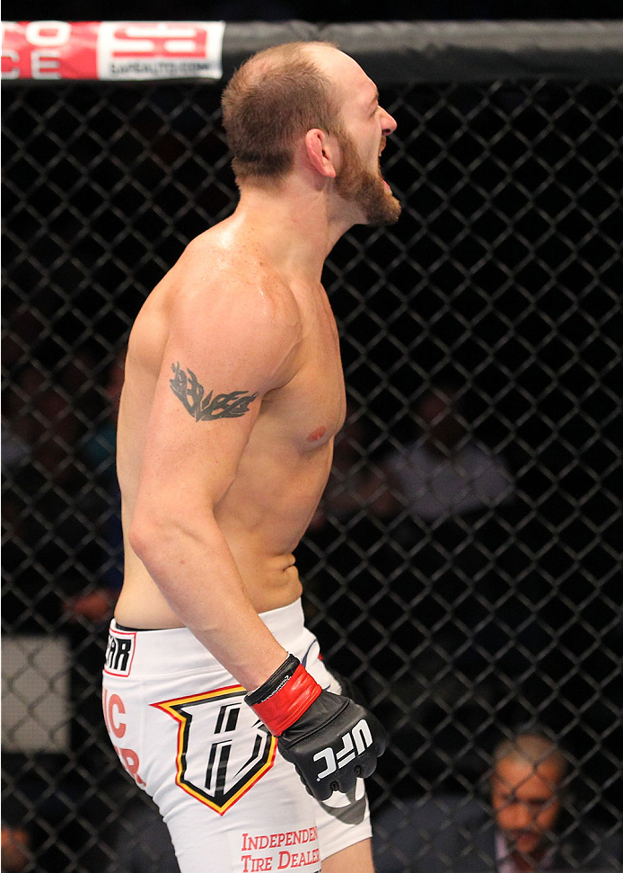 INDIANAPOLIS, IN - AUGUST 28: Zak Cummings reacts after his submission victory over Benny Alloway in their welterweight fight during the UFC on FOX Sports 1 event at Bankers Life Fieldhouse on August 28, 2013 in Indianapolis, Indiana. (Photo by Ed Mulhol