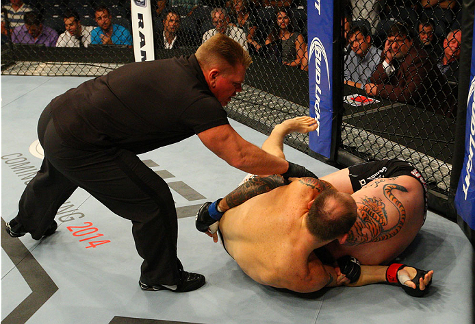 INDIANAPOLIS, IN - AUGUST 28: (L-R) Zak Cummings defeats Benny Alloway by submission in their welterweight fight during the UFC on FOX Sports 1 event at Bankers Life Fieldhouse on August 28, 2013 in Indianapolis, Indiana. (Photo by Ed Mulholland/Zuffa LL