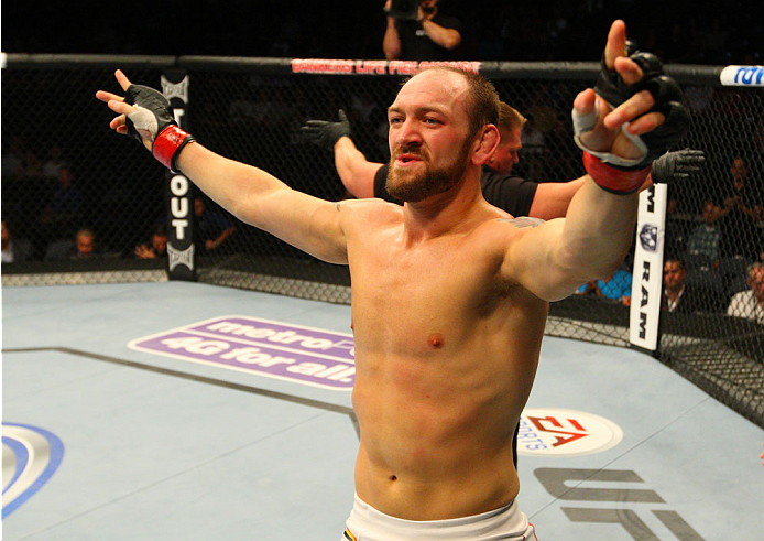 INDIANAPOLIS, IN - AUGUST 28: Zak Cummings reacts after his submission victory over Benny Alloway in their welterweight fight during the UFC on FOX Sports 1 event at Bankers Life Fieldhouse on August 28, 2013 in Indianapolis, Indiana. (Photo by Ed Mulhol
