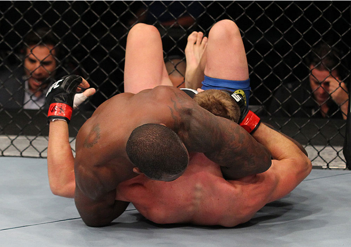 INDIANAPOLIS, IN - AUGUST 28: (L-R) Jason High secures a guillotine choke submission against James Head in their welterweight fight during the UFC on FOX Sports 1 event at Bankers Life Fieldhouse on August 28, 2013 in Indianapolis, Indiana. (Photo by Ed M