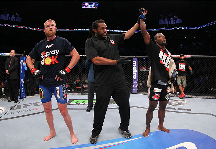 INDIANAPOLIS, IN - AUGUST 28: Jason High (R) reacts after his submission victory over James Head (L) in their welterweight fight during the UFC on FOX Sports 1 event at Bankers Life Fieldhouse on August 28, 2013 in Indianapolis, Indiana. (Photo by Ed Mul