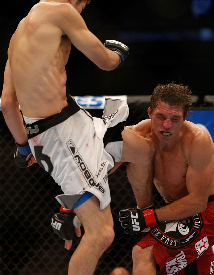 INDIANAPOLIS, IN - AUGUST 28: (L-R) Hatsu Hioki knees Darren Elkins in their featherweight fight during the UFC on FOX Sports 1 event at Bankers Life Fieldhouse on August 28, 2013 in Indianapolis, Indiana. (Photo by Josh Hedges/Zuffa LLC/Zuffa LLC via Ge
