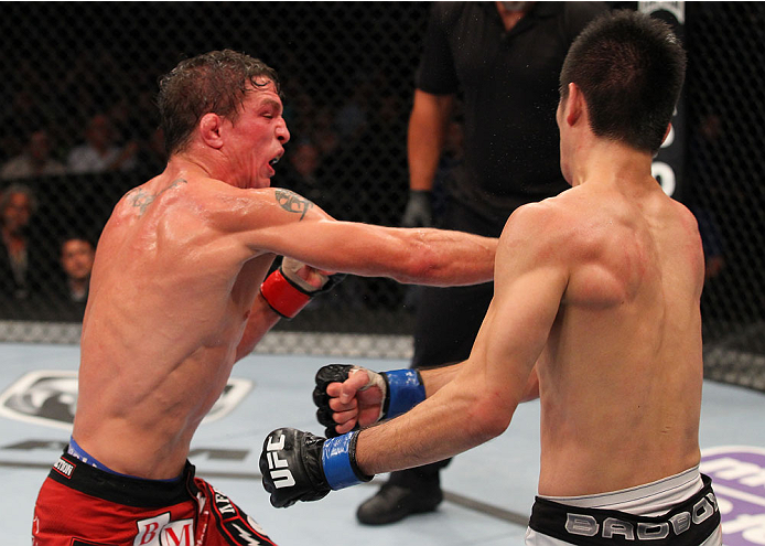 INDIANAPOLIS, IN - AUGUST 28: (L-R) Darren Elkins punches Hatsu Hioki in their featherweight fight during the UFC on FOX Sports 1 event at Bankers Life Fieldhouse on August 28, 2013 in Indianapolis, Indiana. (Photo by Ed Mulholland/Zuffa LLC/Zuffa LLC vi