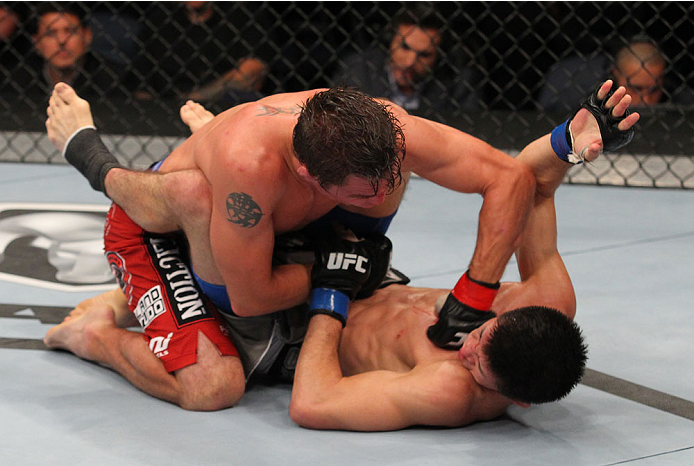 INDIANAPOLIS, IN - AUGUST 28: (L-R) Darren Elkins punches Hatsu Hioki in their featherweight fight during the UFC on FOX Sports 1 event at Bankers Life Fieldhouse on August 28, 2013 in Indianapolis, Indiana. (Photo by Ed Mulholland/Zuffa LLC/Zuffa LLC vi