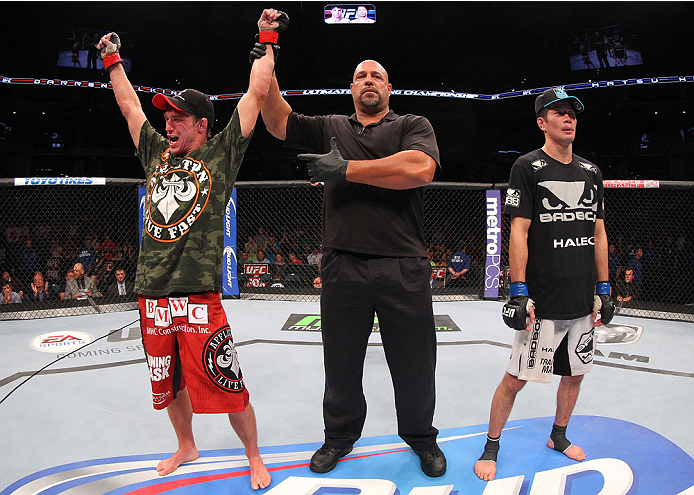 INDIANAPOLIS, IN - AUGUST 28: Darren Elkins (L) reacts after his victory over Hatsu Hioki (R) in their featherweight fight during the UFC on FOX Sports 1 event at Bankers Life Fieldhouse on August 28, 2013 in Indianapolis, Indiana. (Photo by Ed Mulhollan