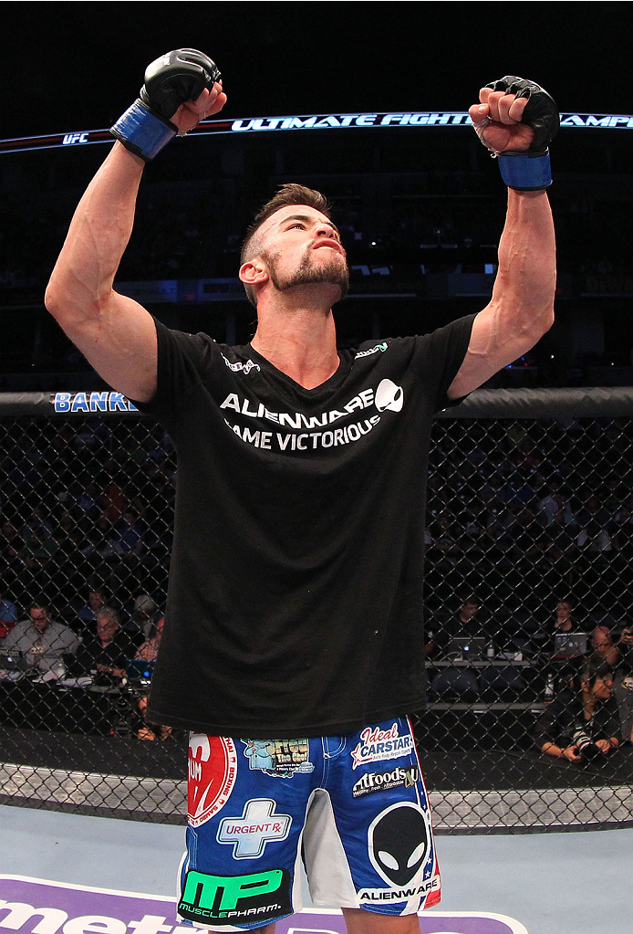 INDIANAPOLIS, IN - AUGUST 28: Brandon Thatch reacts after his knockout victory over Justin Edwards in their welterweight fight during the UFC on FOX Sports 1 event at Bankers Life Fieldhouse on August 28, 2013 in Indianapolis, Indiana. (Photo by Ed Mulho
