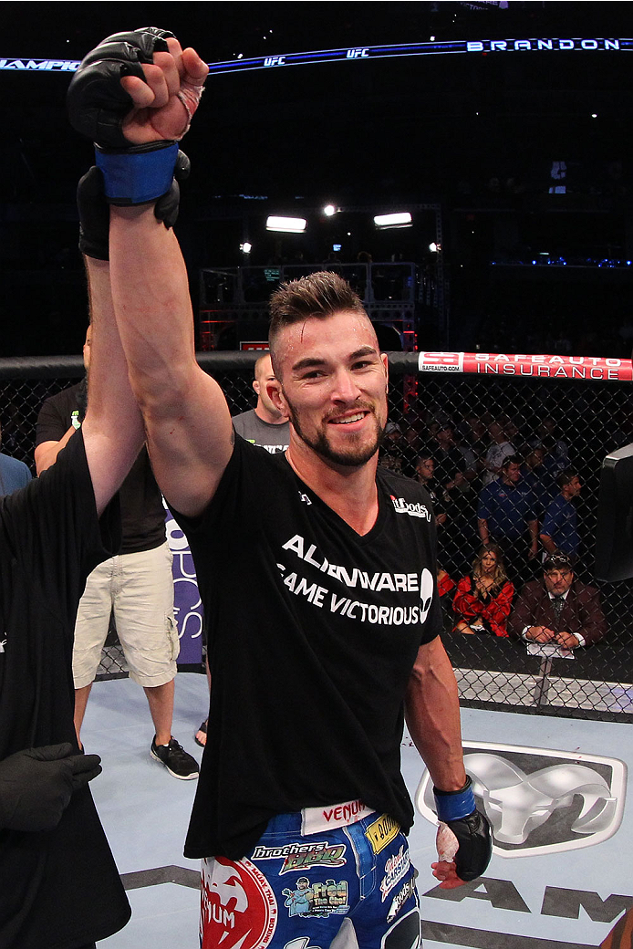 INDIANAPOLIS, IN - AUGUST 28: Brandon Thatch reacts after his knockout victory over Justin Edwards in their welterweight fight during the UFC on FOX Sports 1 event at Bankers Life Fieldhouse on August 28, 2013 in Indianapolis, Indiana. (Photo by Ed Mulho