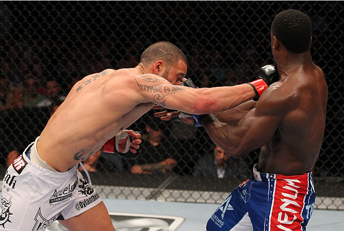 INDIANAPOLIS, IN - AUGUST 28: (L-R) Dylan Andrews punches Papy Abedi in their middleweight fight during the UFC on FOX Sports 1 event at Bankers Life Fieldhouse on August 28, 2013 in Indianapolis, Indiana. (Photo by Ed Mulholland/Zuffa LLC/Zuffa LLC via