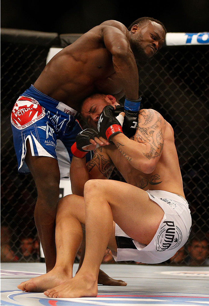 INDIANAPOLIS, IN - AUGUST 28: (L-R) Papy Abedi attempts a guillotine choke against Dylan Andrews in their middleweight fight during the UFC on FOX Sports 1 event at Bankers Life Fieldhouse on August 28, 2013 in Indianapolis, Indiana. (Photo by Josh Hedge