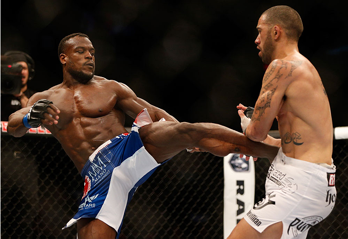 INDIANAPOLIS, IN - AUGUST 28: (L-R) Papy Abedi kicks Dylan Andrews in their middleweight fight during the UFC on FOX Sports 1 event at Bankers Life Fieldhouse on August 28, 2013 in Indianapolis, Indiana. (Photo by Josh Hedges/Zuffa LLC/Zuffa LLC via Gett