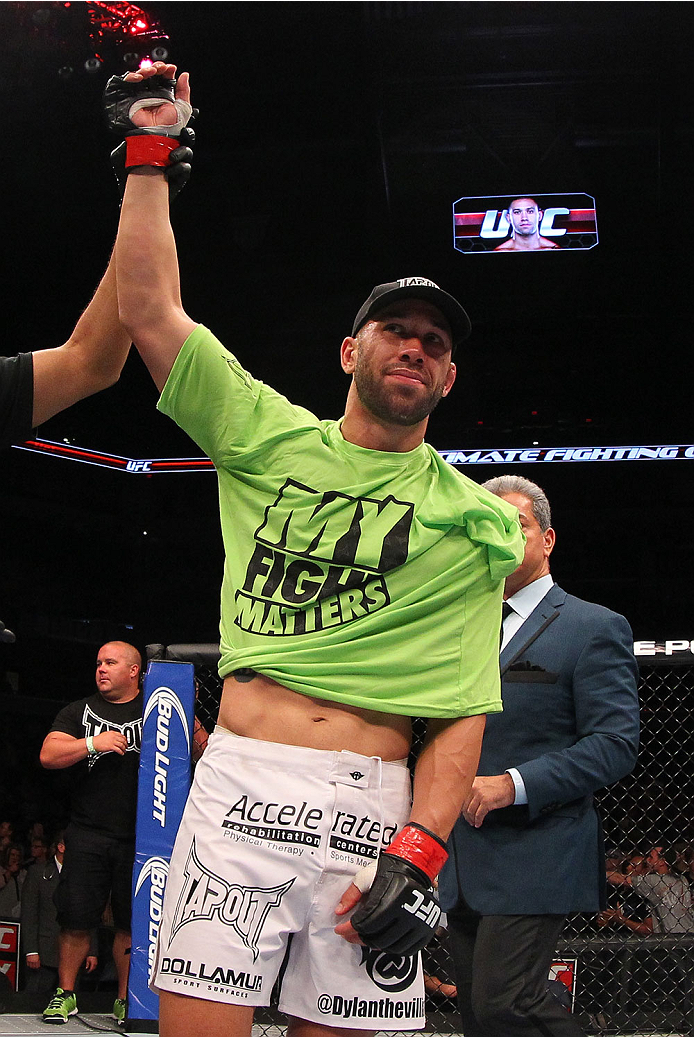 INDIANAPOLIS, IN - AUGUST 28: Dylan Andrews reacts after knocking out Papy Abedi in their middleweight fight during the UFC on FOX Sports 1 event at Bankers Life Fieldhouse on August 28, 2013 in Indianapolis, Indiana. (Photo by Ed Mulholland/Zuffa LLC/Zu