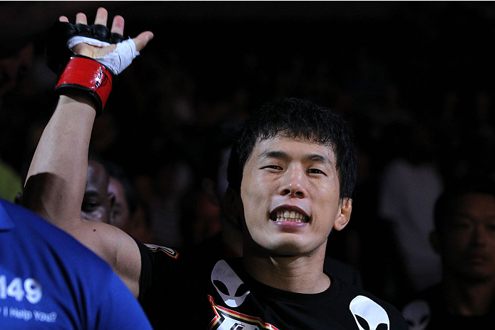 INDIANAPOLIS, IN - AUGUST 28: Takeya Mizugaki enters the arena before his bantamweight fight against Erik Perez during the UFC on FOX Sports 1 event at Bankers Life Fieldhouse on August 28, 2013 in Indianapolis, Indiana. (Photo by Ed Mulholland/Zuffa LLC