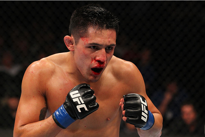 INDIANAPOLIS, IN - AUGUST 28: Erik Perez stands in the Octagon during his bantamweight fight against Takeya Mizugaki during the UFC on FOX Sports 1 event at Bankers Life Fieldhouse on August 28, 2013 in Indianapolis, Indiana. (Photo by Ed Mulholland/Zuff
