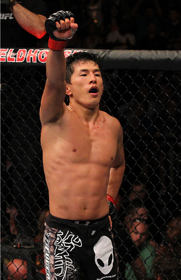 INDIANAPOLIS, IN - AUGUST 28: Takeya Mizugaki reacts after his bantamweight fight against Erik Perez during the UFC on FOX Sports 1 event at Bankers Life Fieldhouse on August 28, 2013 in Indianapolis, Indiana. (Photo by Ed Mulholland/Zuffa LLC/Zuffa LLC