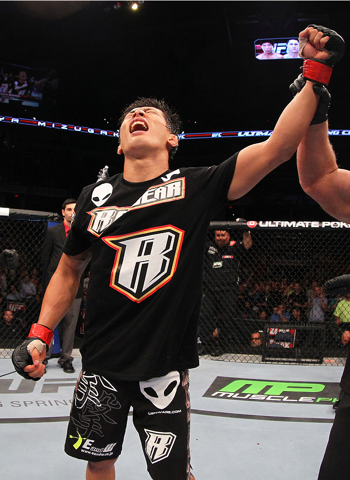 INDIANAPOLIS, IN - AUGUST 28: Takeya Mizugaki reacts after his victory over Erik Perez in their bantamweight fight during the UFC on FOX Sports 1 event at Bankers Life Fieldhouse on August 28, 2013 in Indianapolis, Indiana. (Photo by Ed Mulholland/Zuffa