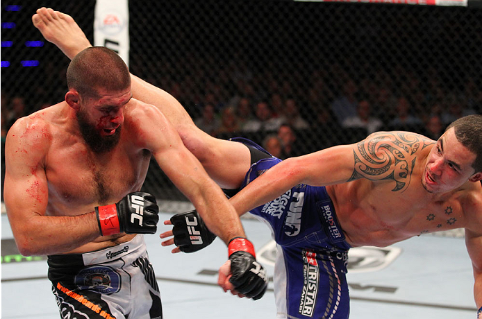 INDIANAPOLIS, IN - AUGUST 28: (R-L) Robert Whittaker kicks Court McGee in their welterweight fight during the UFC on FOX Sports 1 event at Bankers Life Fieldhouse on August 28, 2013 in Indianapolis, Indiana. (Photo by Ed Mulholland/Zuffa LLC/Zuffa LLC vi