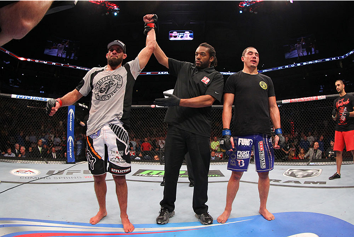 INDIANAPOLIS, IN - AUGUST 28: Court McGee (L) reacts after his victory over Robert Whittaker (R) in their welterweight fight during the UFC on FOX Sports 1 event at Bankers Life Fieldhouse on August 28, 2013 in Indianapolis, Indiana. (Photo by Ed Mulholl