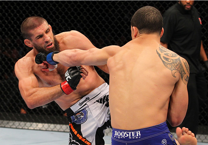 INDIANAPOLIS, IN - AUGUST 28: (R-L) Robert Whittaker punches Court McGee in their welterweight fight during the UFC on FOX Sports 1 event at Bankers Life Fieldhouse on August 28, 2013 in Indianapolis, Indiana. (Photo by Ed Mulholland/Zuffa LLC/Zuffa LLC