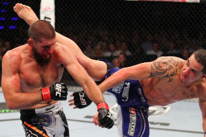 INDIANAPOLIS, IN - AUGUST 28: (R-L) Robert Whittaker kicks Court McGee in their welterweight fight during the UFC on FOX Sports 1 event at Bankers Life Fieldhouse on August 28, 2013 in Indianapolis, Indiana. (Photo by Ed Mulholland/Zuffa LLC/Zuffa LLC vi