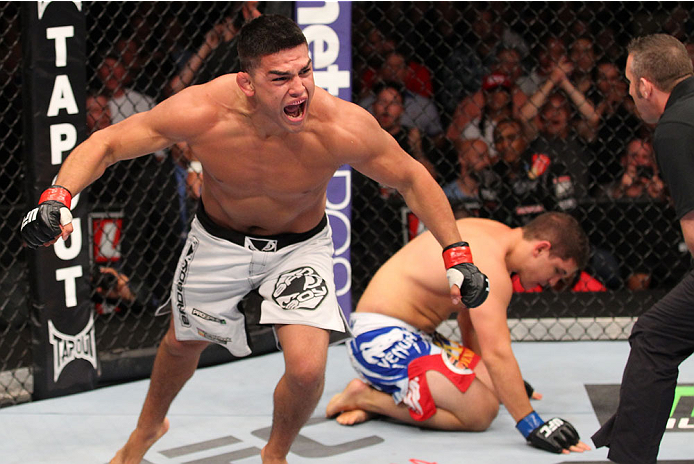 INDIANAPOLIS, IN - AUGUST 28: Kelvin Gastelum reacts after his submission victory over Brian Melancon in their welterweight fight during the UFC on FOX Sports 1 event at Bankers Life Fieldhouse on August 28, 2013 in Indianapolis, Indiana. (Photo by Ed Mu