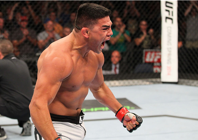 INDIANAPOLIS, IN - AUGUST 28: Kelvin Gastelum reacts after his submission victory over Brian Melancon in their welterweight fight during the UFC on FOX Sports 1 event at Bankers Life Fieldhouse on August 28, 2013 in Indianapolis, Indiana. (Photo by Ed Mu